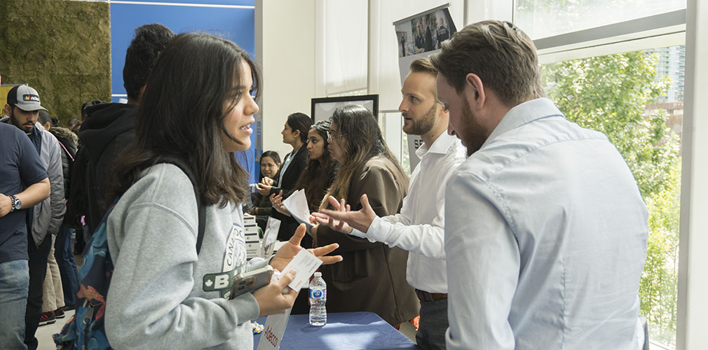 student talking with employer