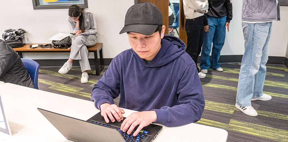 Wei-Lin studying in the library