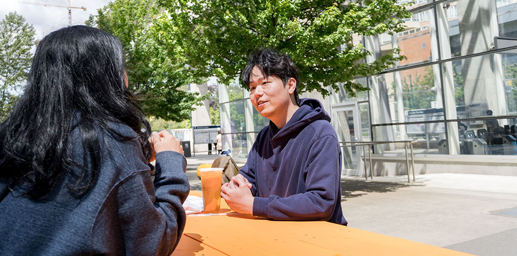 Wei-Lin talking with staff