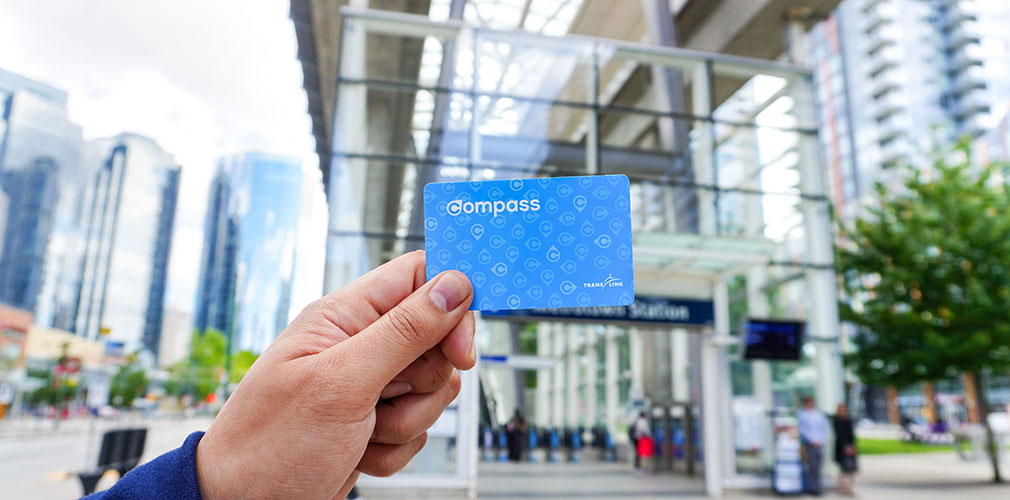 person holding up a Compass Card