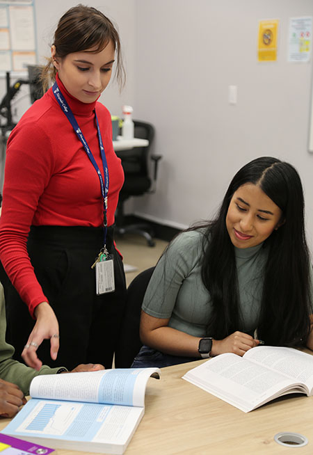 student getting helped by staff