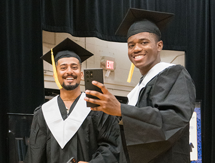 grad students holding up a phone