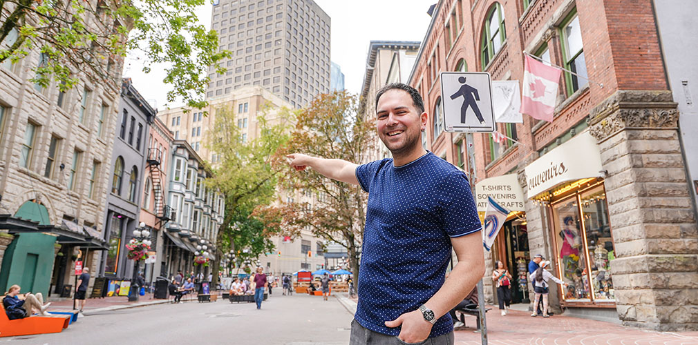 student pointing at Gastown