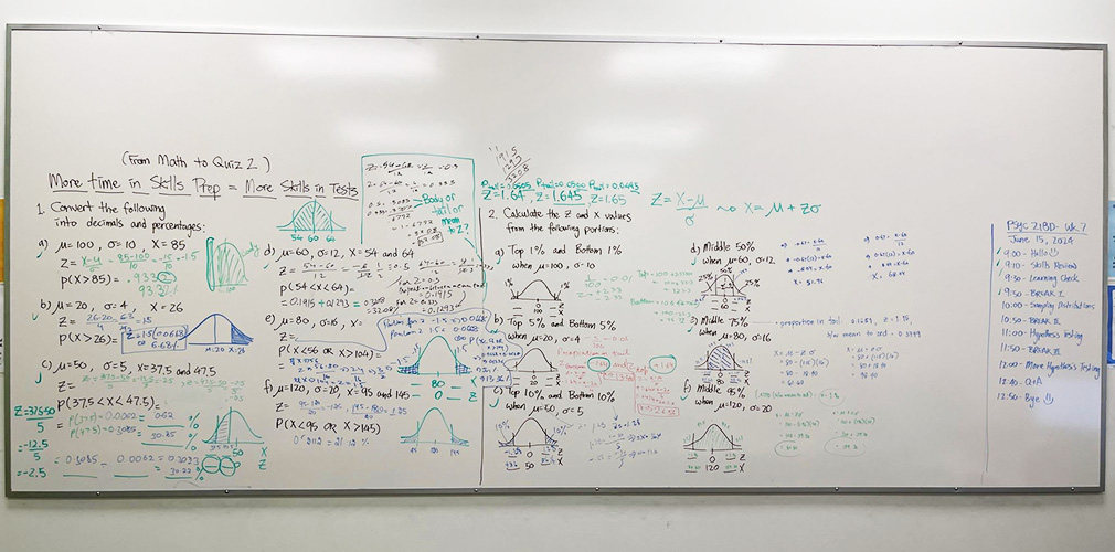 whiteboard filled with classwork