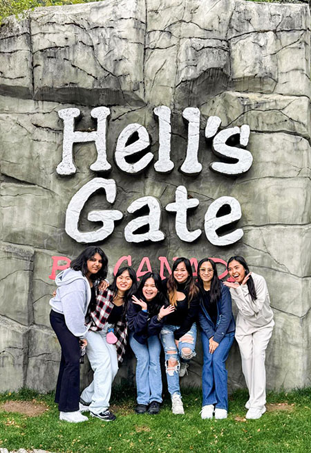 group picture in front of Hell's Gate sign