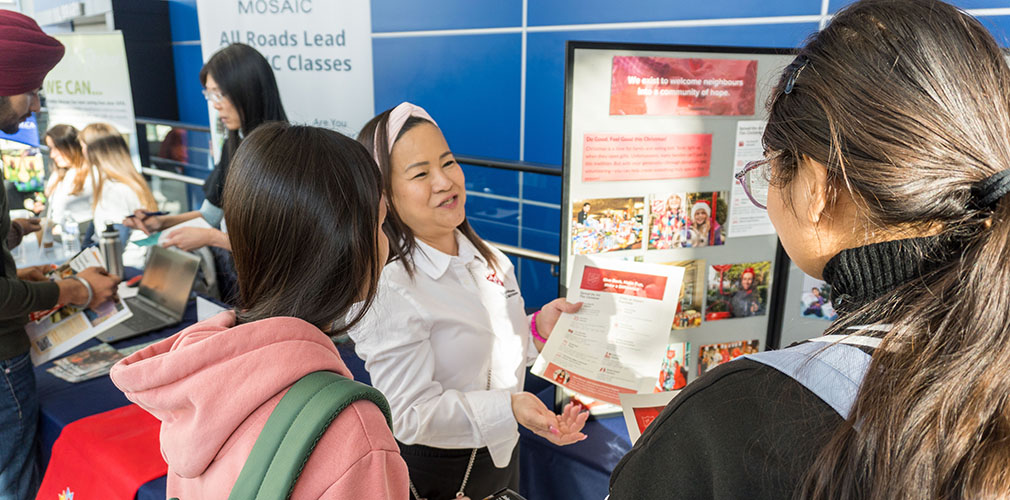 The Salvation Army staff talking to students