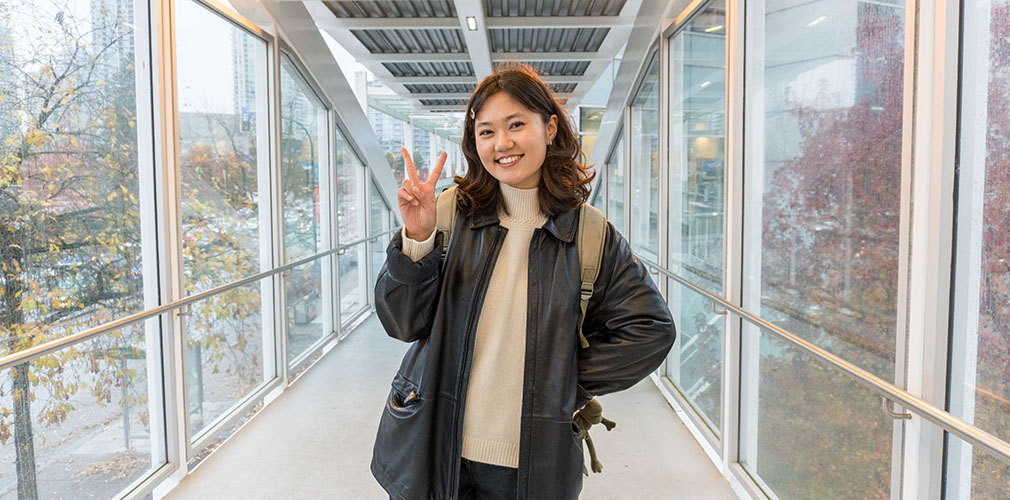 Enkhjin posing with a peace sign