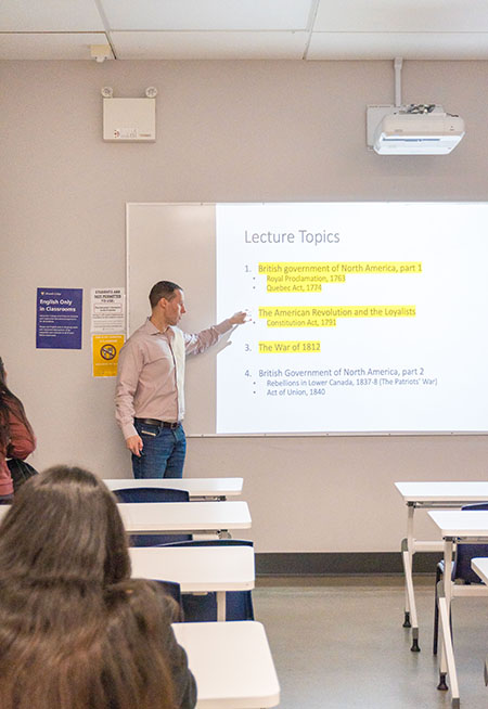 Chris teaching in classroom