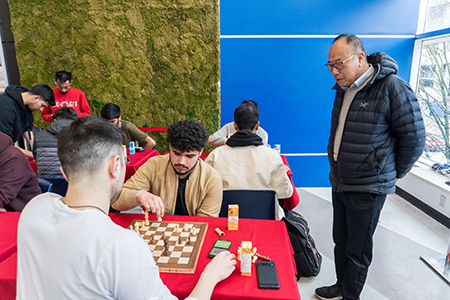 our president observing a chess game