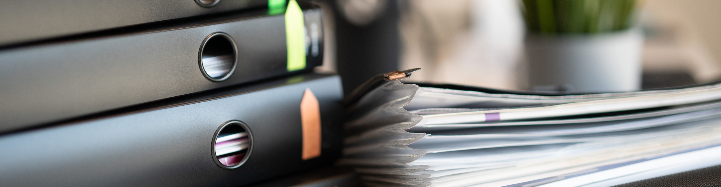 close up shot of staff going through a filing cabinet
